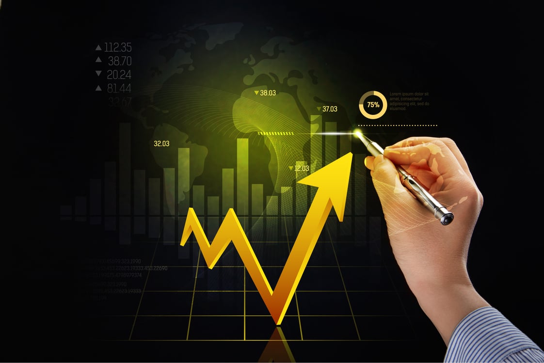 Hand holding pen with finance concept